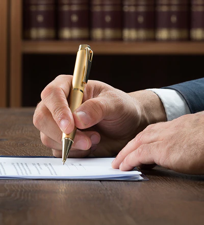 Person writing at desk